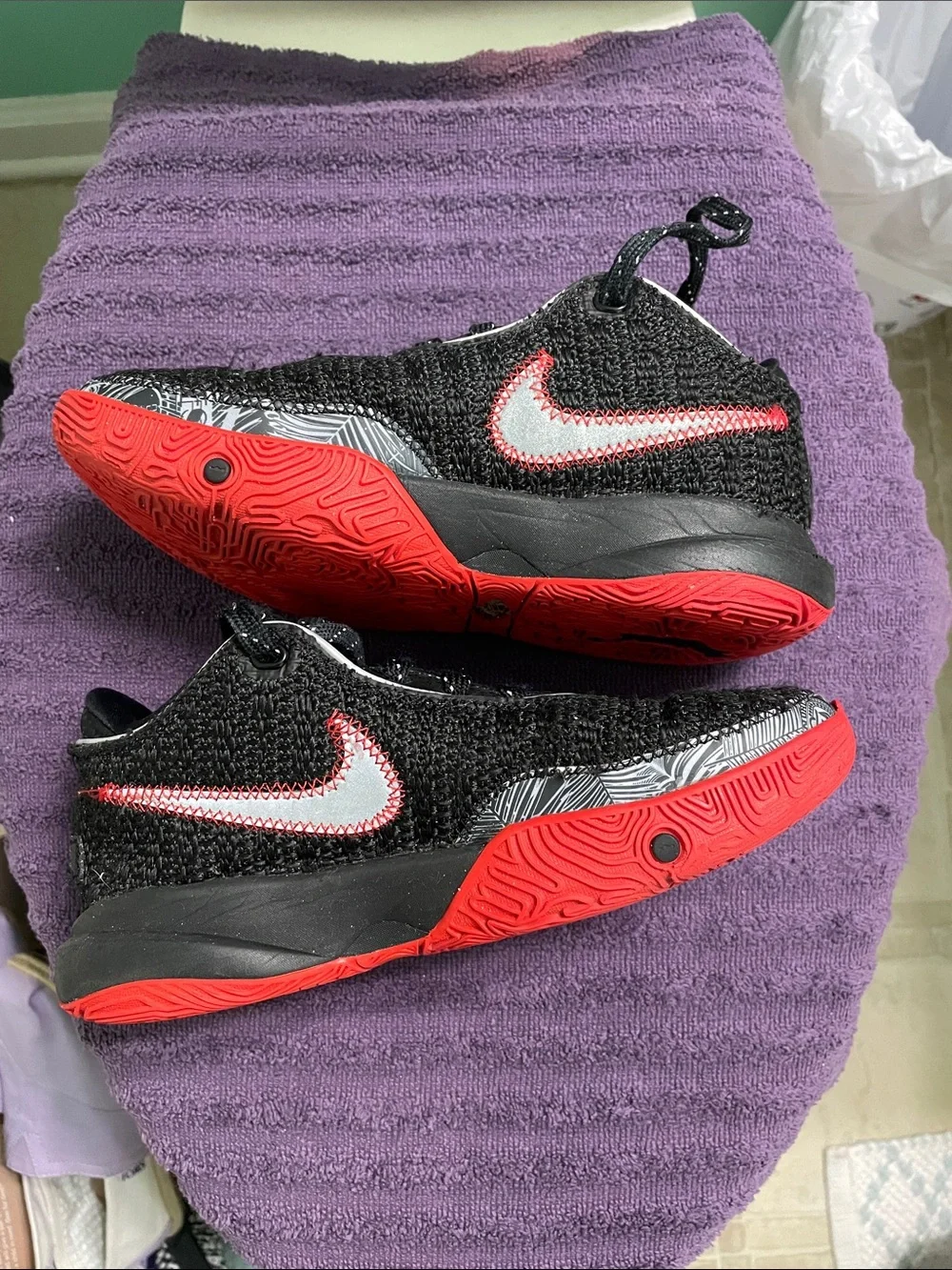 Nike Black Knit Sneakers with Gold Swoosh and Red Accents